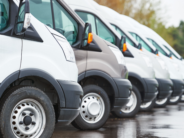 Fleet Vans lined up in a parking lot